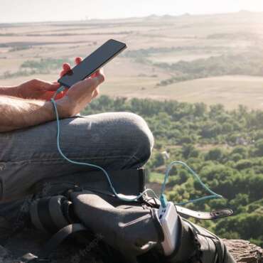 Man Hike Uses Smartphone While Charging From Power Bank